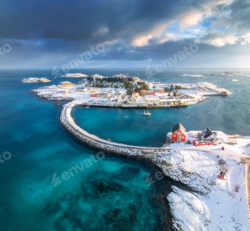 Preview: Aerial view of road, bridges, snowy islands, rorbu, sea at sunset