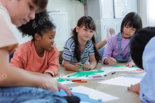 Preview: Diversity of elementary students studying in classroom art activity on the floor