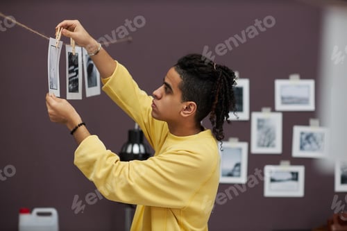 Preview: Professional photographer printing photos in studio