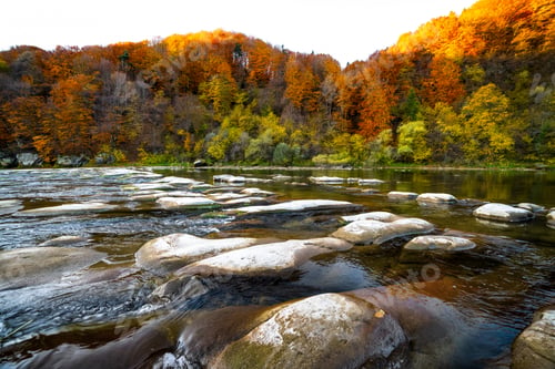 Preview: River rapids with autumn forests on banks