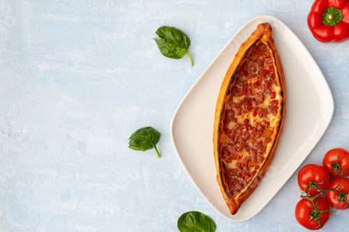Preview: Turkish baked Pide bread on light blue wooden surface