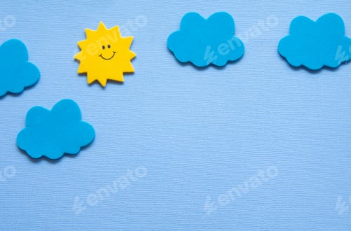 Smiling Sun with Clouds on Blue Background