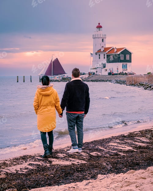 Preview: Paard van Marken Lighthouse in the netherlands, couple visiting the fishing village Marken Holland