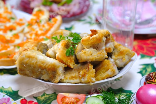 Preview: Ukrainian Easter festive dishes. Festive table setting. Bright colored eggs, cake Paska