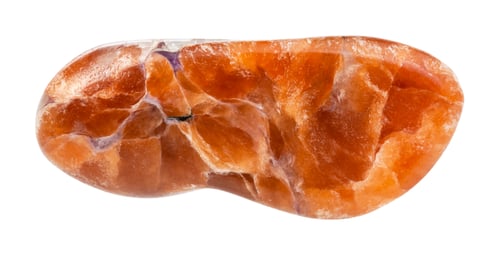 Preview: polished Tinaksite gemstone isolated on white