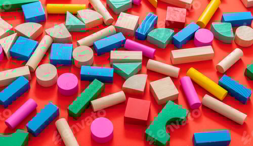 Preview: Wooden colorful blocks on red color background