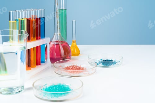 Preview: Chemical laboratory glassware with various colored liquids on table