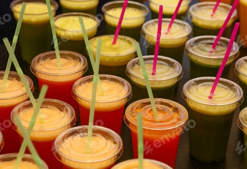 Preview: Many plastic glasses of fresh juices and smoothies