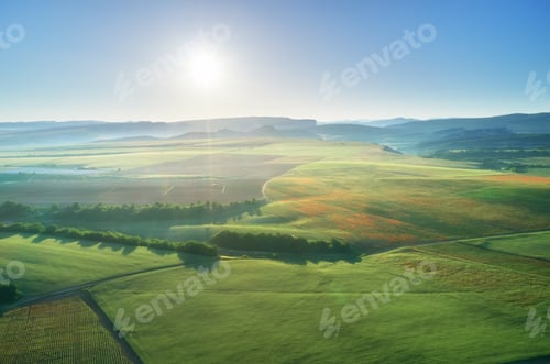 Preview: Aerial fields and meadow in mountain.
