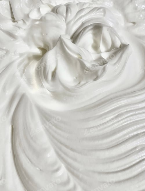 Preview: White dairy product swirl closeup. Creamy healthy natural food macro photography. Top view.