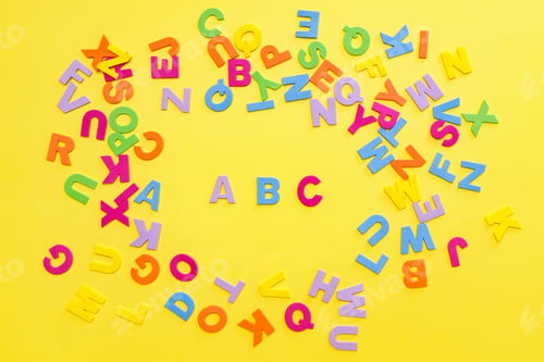 Preview: Back to school concept. Detailed plastic letters on yellow background