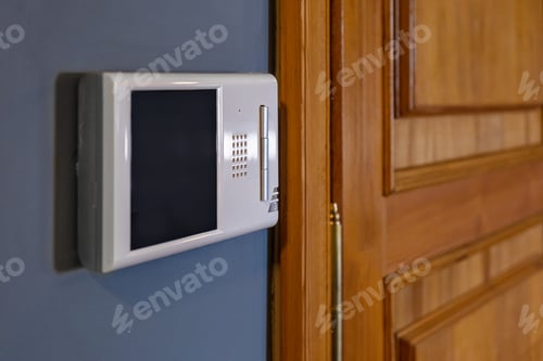 Preview: Video intercom display near the entrance door at home close up