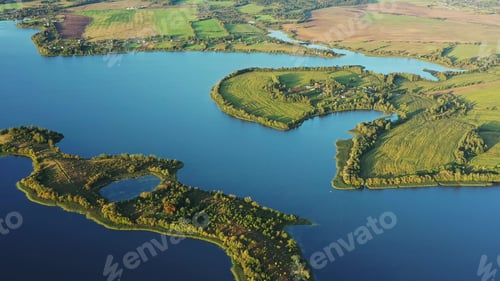 Preview: 4K Blue Water Of Lake River And Green Countryside Landscape With Growing Greenery Forest. Aerial