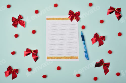 Preview: Blank sheet of paper with pen on blue background with Christmas decorations