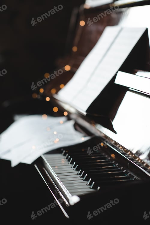 Preview: Piano keys with notes in dark close up