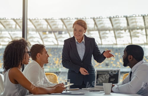 Preview: Multiracial coworkers group working together at office of stadium