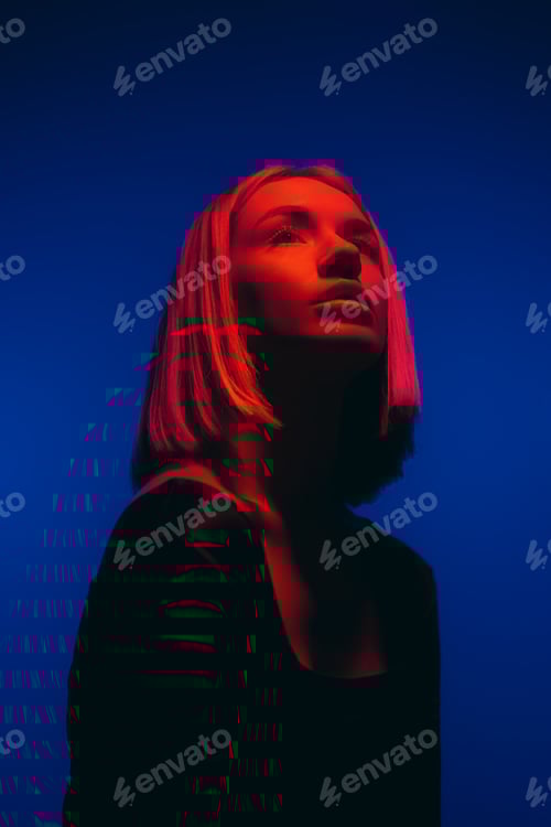 Preview: Woman with Short Blonde Hair in Red Lighting