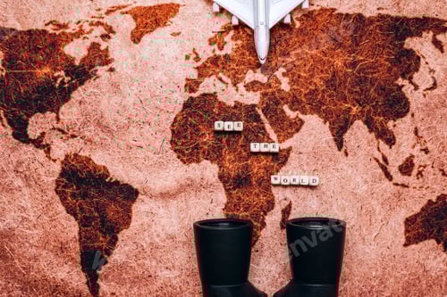 Preview: Binoculars, map and model of an airplane on the table. Top view of traveler basics concept.