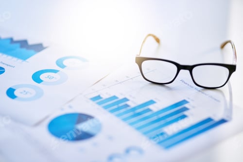 Preview: The proof is in the profit. Shot of business documentation and glasses on an office desk.