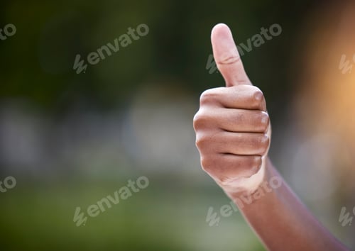 Preview: Shot of an unrecognizable person showing a thumbs up outside