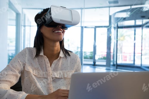 Preview: Female executive using virtual reality headset