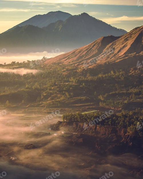Preview: Vertical shot of Mount Batur under the sunlight during a beautiful sunrise in Indonesia