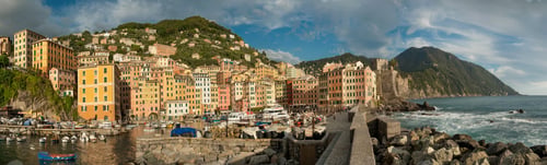 Preview: the embankment and port of the town of Camogli, colorful houses and fortress
