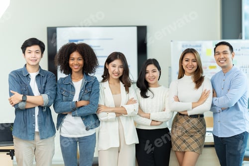 Preview: Business people showing team work while working in board room in office interior.