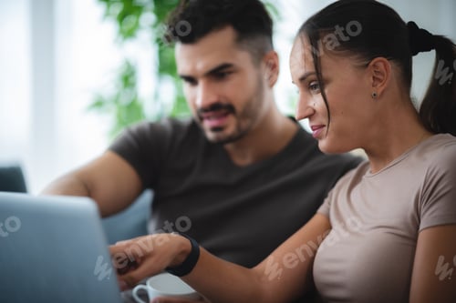 Preview: man and woman couple person are working together with laptop from home