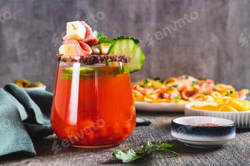 Preview: Cocktail and snack in one serving in a glass on the table