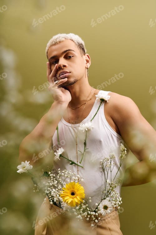 Preview: Young African American man showcases trendy floral fashion in stylish studio setting
