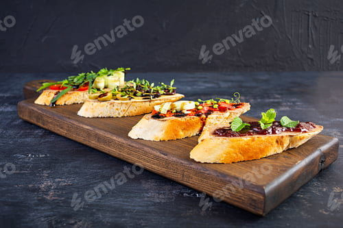 Preview: Delicious Bruschetta Toppings on Rustic Wooden Board