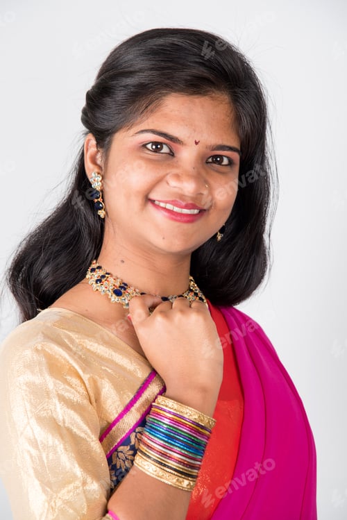 Preview: Happy young beautiful Indian woman in saree.