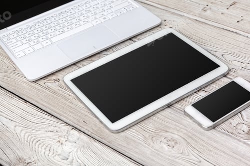 Preview: Open laptop with digital tablet on the table