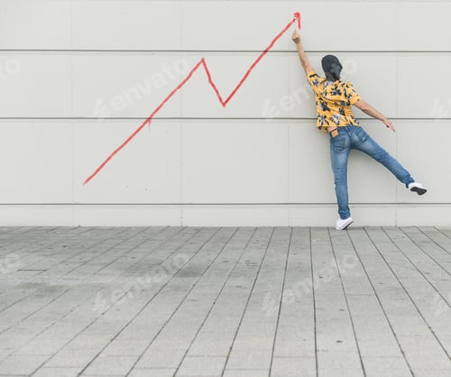Preview: Digital composite of young man drawing a line graph at a wall