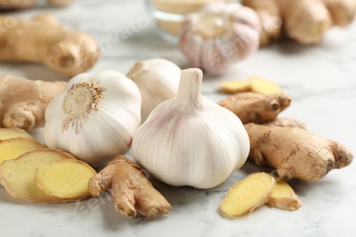 Preview: Ginger and fresh garlic on table. Natural cold remedies