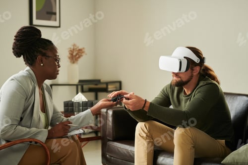Preview: Man using VR glasses during psychotherapy session