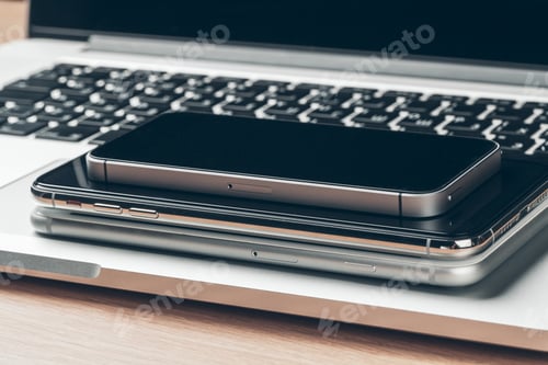 Preview: Laptop and mobile phone on the table. Workspace concept