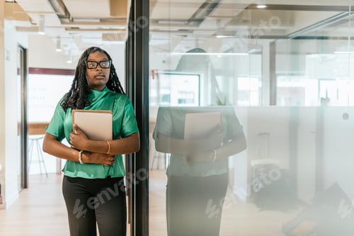 Preview: Professional woman in coworking space with laptop
