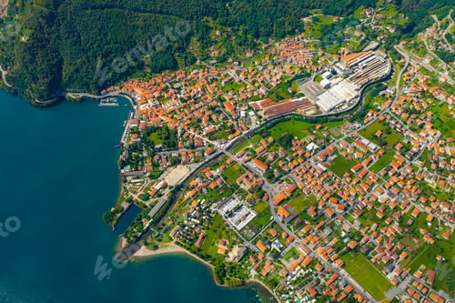 Preview: Aerial view of Como lake, Dongo, Italy. Coastline is washed by blue turquoise water