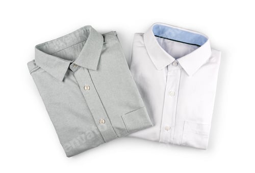 Preview: Crisp Dress Shirts Neatly Folded on White Backdrop