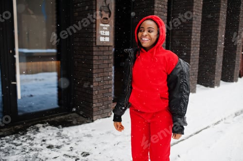 Smiling Woman in a Red Suit Outdoors in Winter