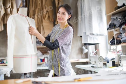 Preview: Fashion designer working in studio