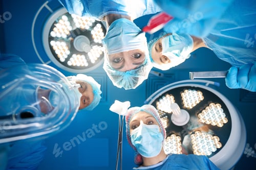 Preview: Group of surgeons doctors holding sterile equipment
