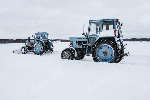 Preview: Tractors cleaning snow from field