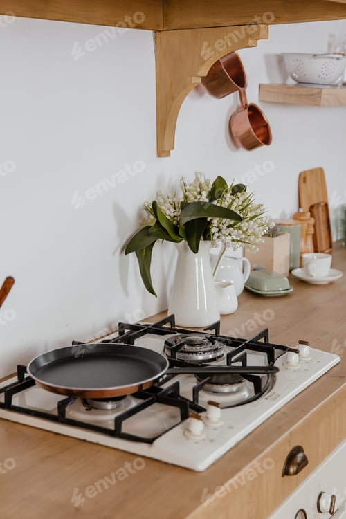 Preview: Side view of scandinavian style kitchen interior in white tones with stove, sink and shelves. Luxury