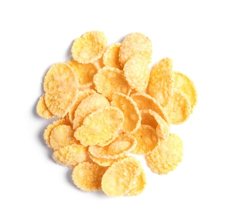 Preview: Crispy cornflakes on white background, top view. Healthy breakfast