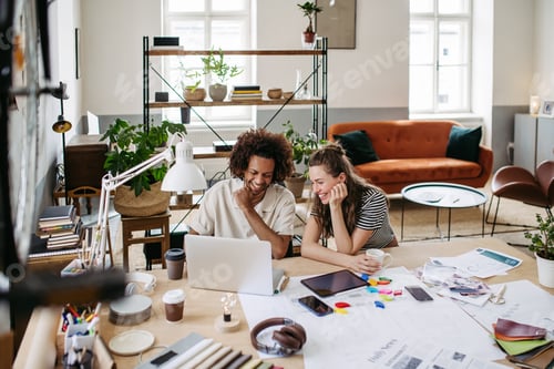 Preview: Young colleagues working together in startup company.
