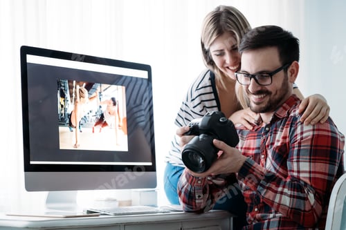 Preview: Young attractive designers working on project together