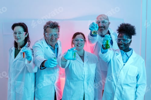 Preview: group photo of research scientists wearing a white coat